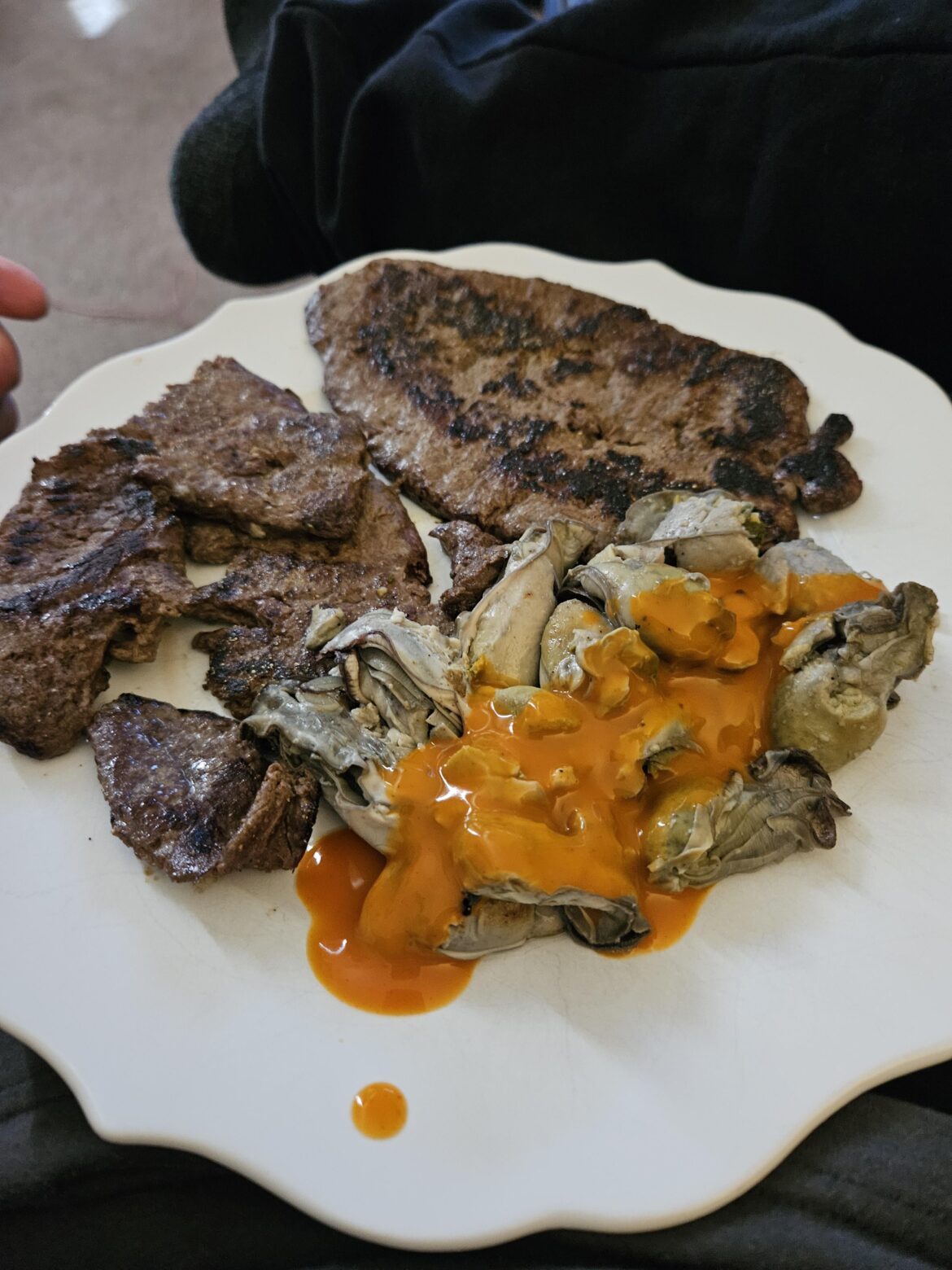 Liver with a side of oysters in hot sauce.