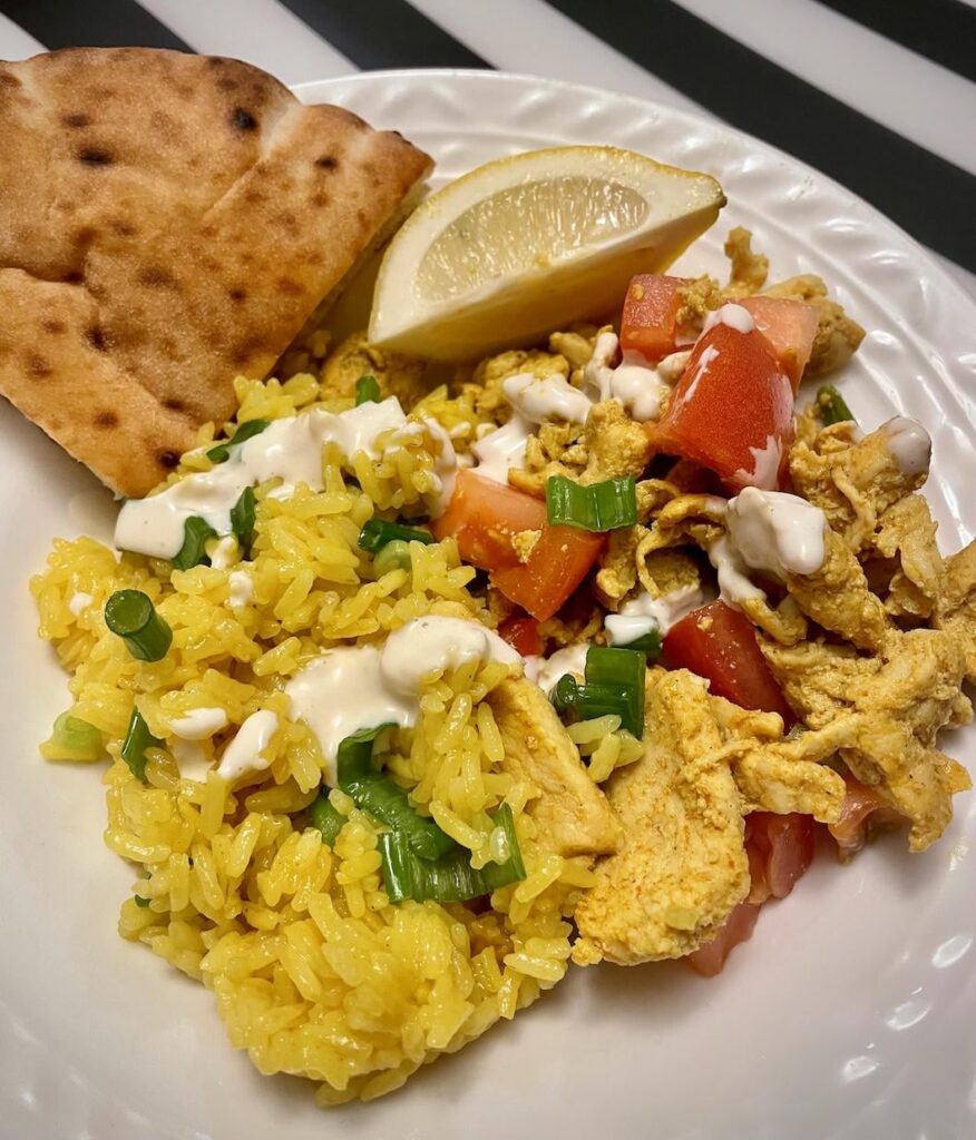 Street Cart-Style Chicken Bowls with Yellow Rice, White Sauce & Pita Wedges