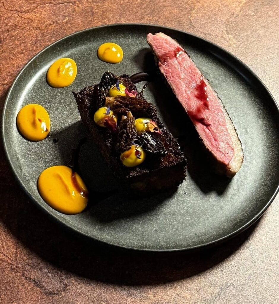 Seared duck, sourdough plank, kabocha puree, honeynut puree, morels, pomegranate reduction