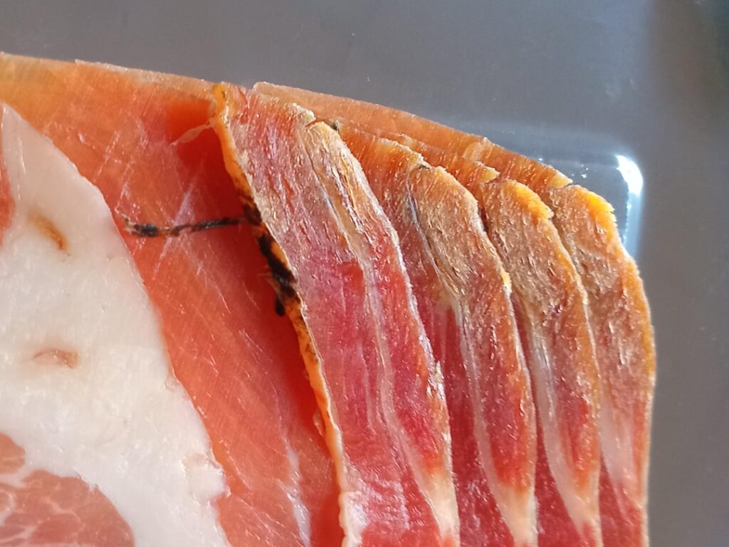 What are these black marks on my parma ham?