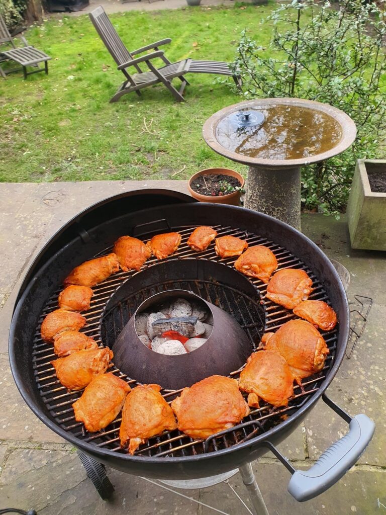 Chicken thighs with Nandos Peri Peri Sauce Hot on Weber 22"