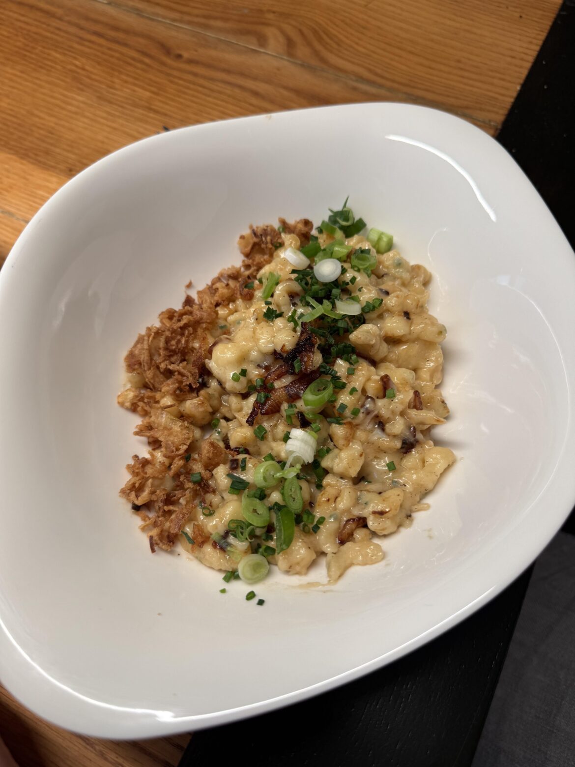 Cheese spaetzle with fried and spring onions