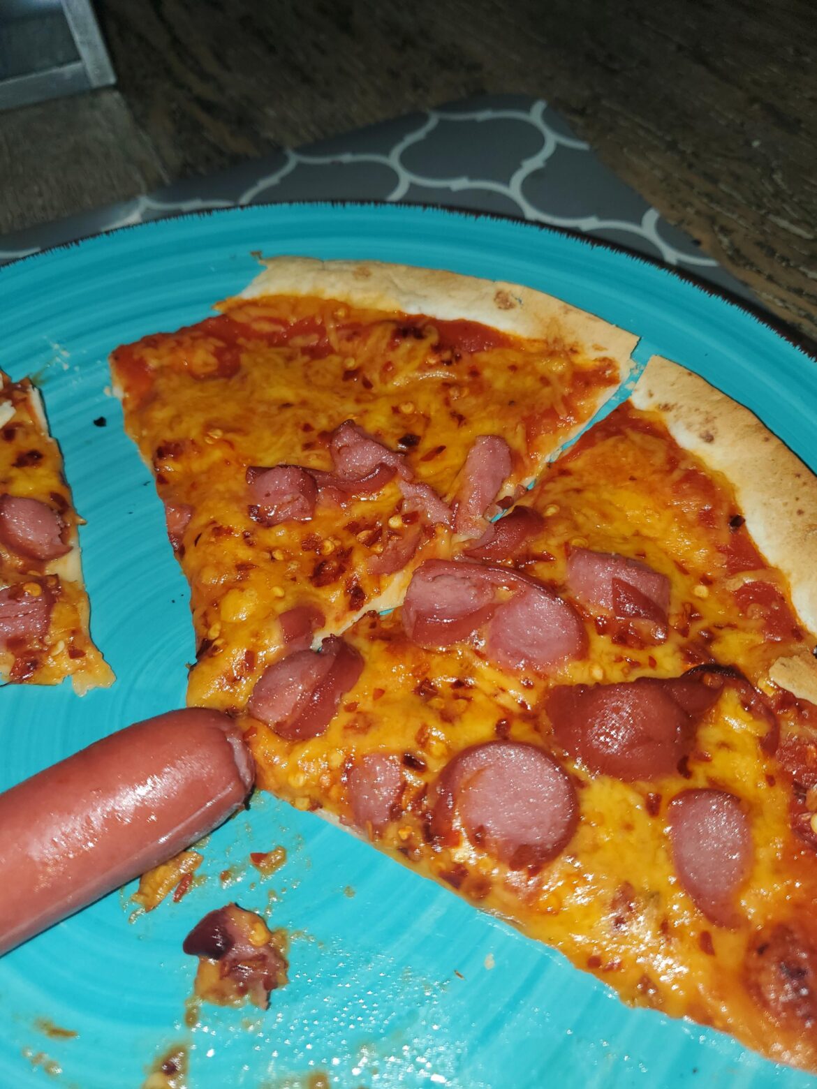Tortilla bread pizza with hotdog toppings