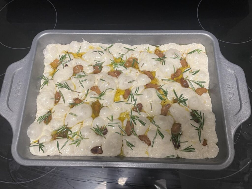 First focaccia attempt! Garlic confit and rosemary First focaccia attempt! Garlic confit and rosemary