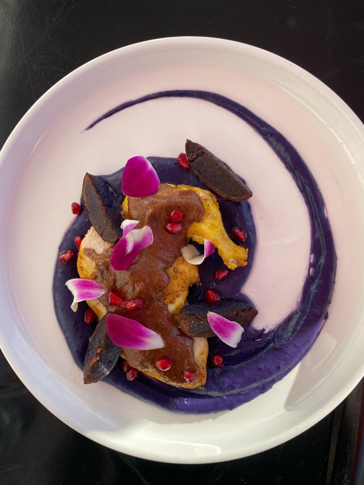 Airline chicken, pomegranate walnut sauce, purple potato puree