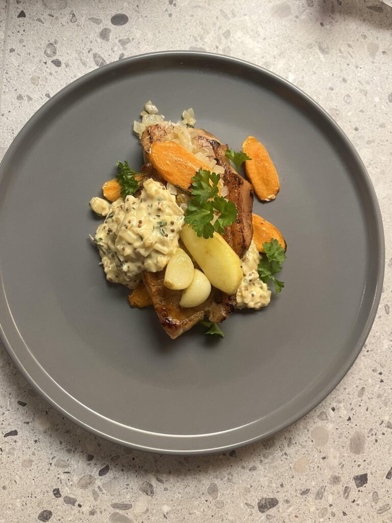 Pork loin mustard cream sauce with roasted carrot onion apple & garlic