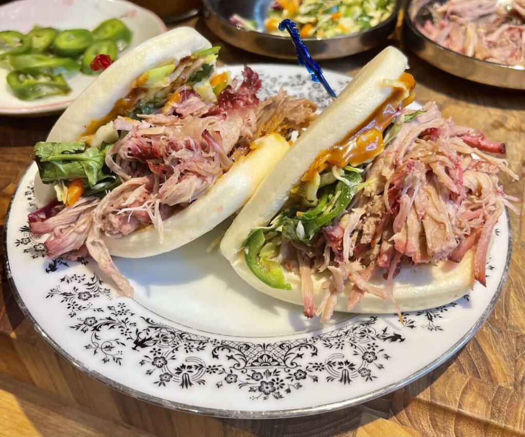 6hr smoked char siu pulled pork bao with hoisin chili crisp mayo and jalapeno cilantro slaw