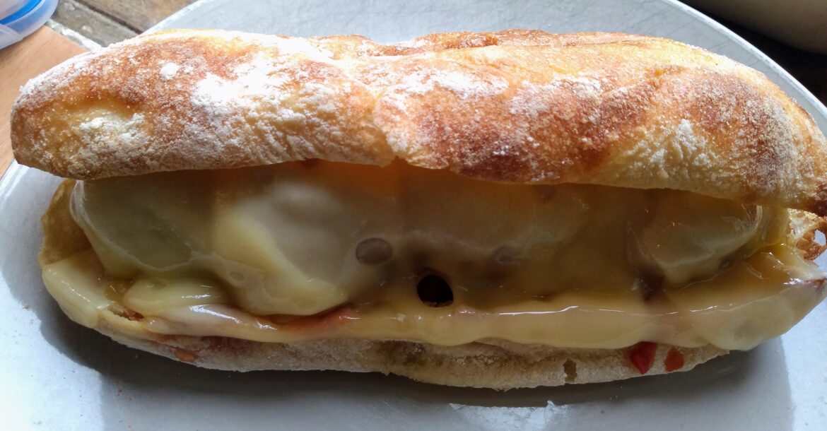 Meatballs, marinara and Emmental on a half ciabatta loaf.