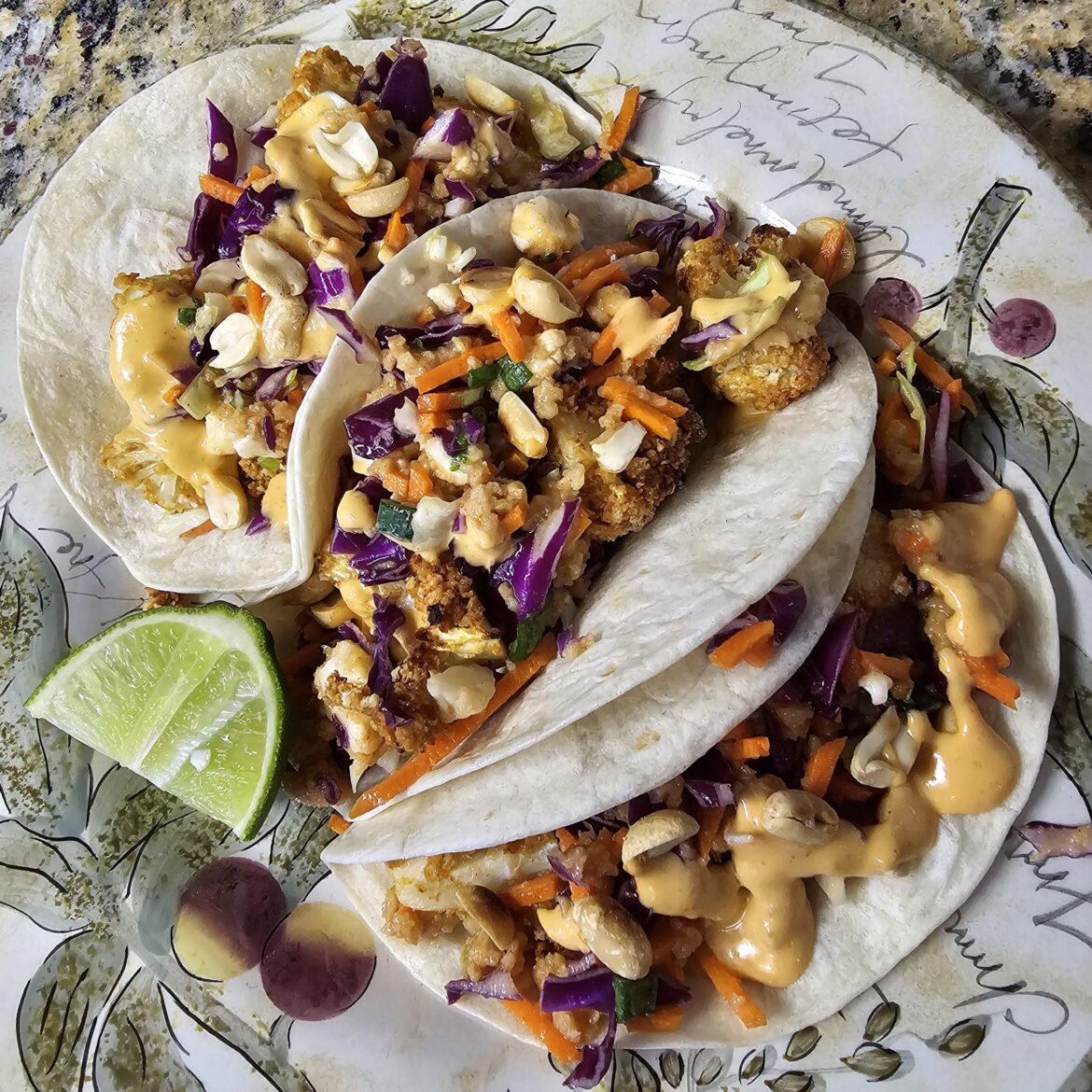 Crispy cauliflower tacos with peanut sauce and Sriracha lime vegan mayo