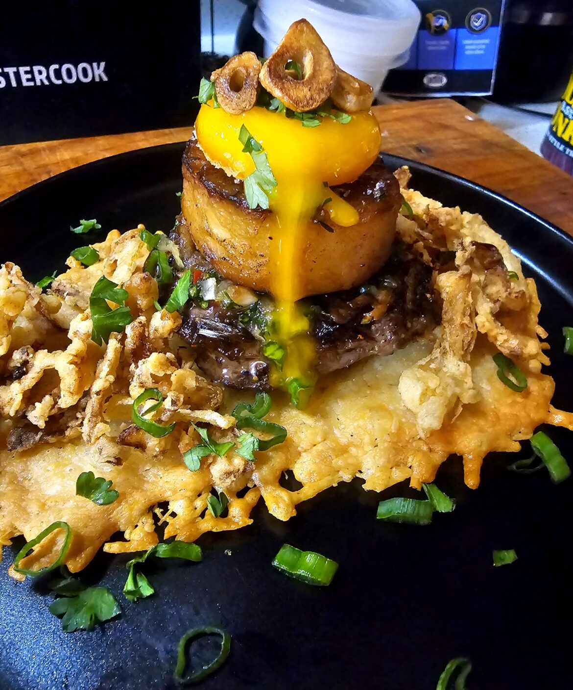 Flank Steak, Fondant Potato, Cured Egg Yolk, Chimichurri, Parmesan Crisp, Fried Onions & Garlic