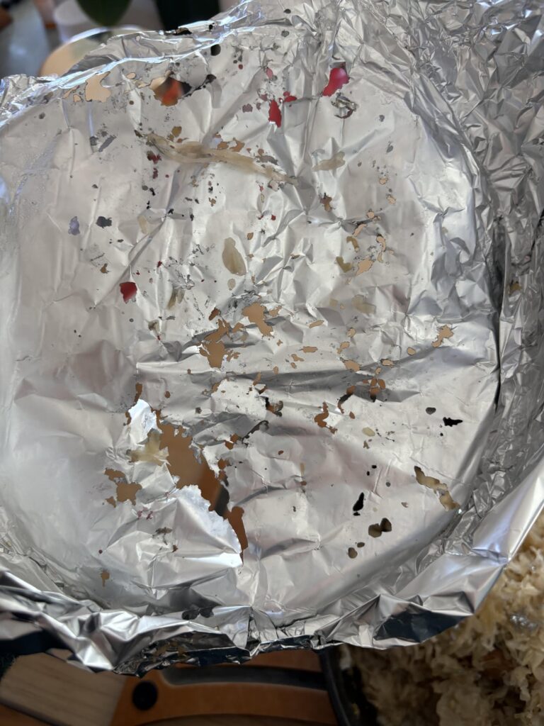 My Sourkrout fucking disintegrated my aluminum foil, is it still okay to eat?