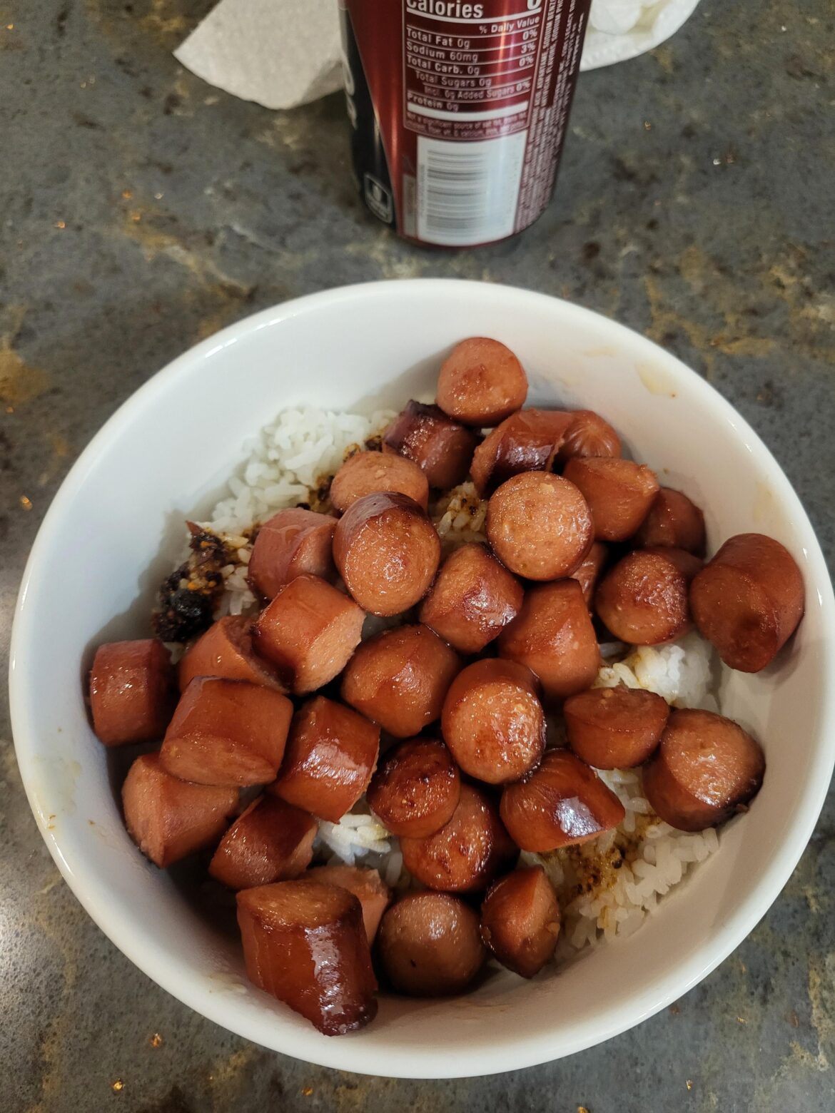 White rice, chili oil and cut up hot dogs