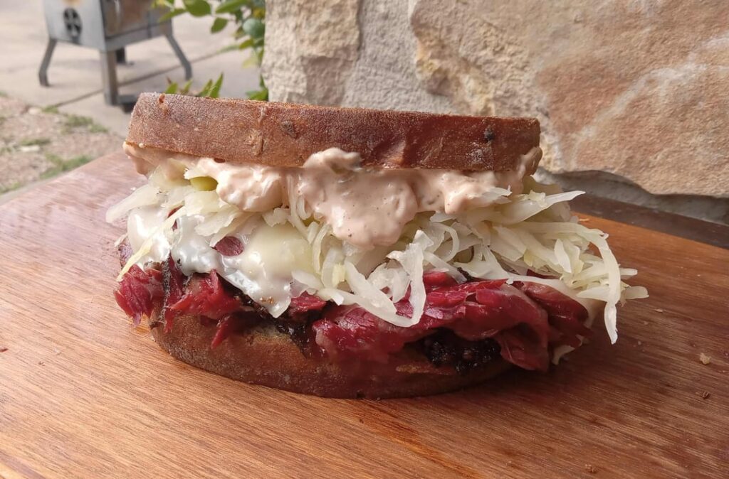 The 97.44% Home Made from Scratch Pastrami Reuben (my cow is in the shop so I couldn't make the cheese).  Method/details in comment.