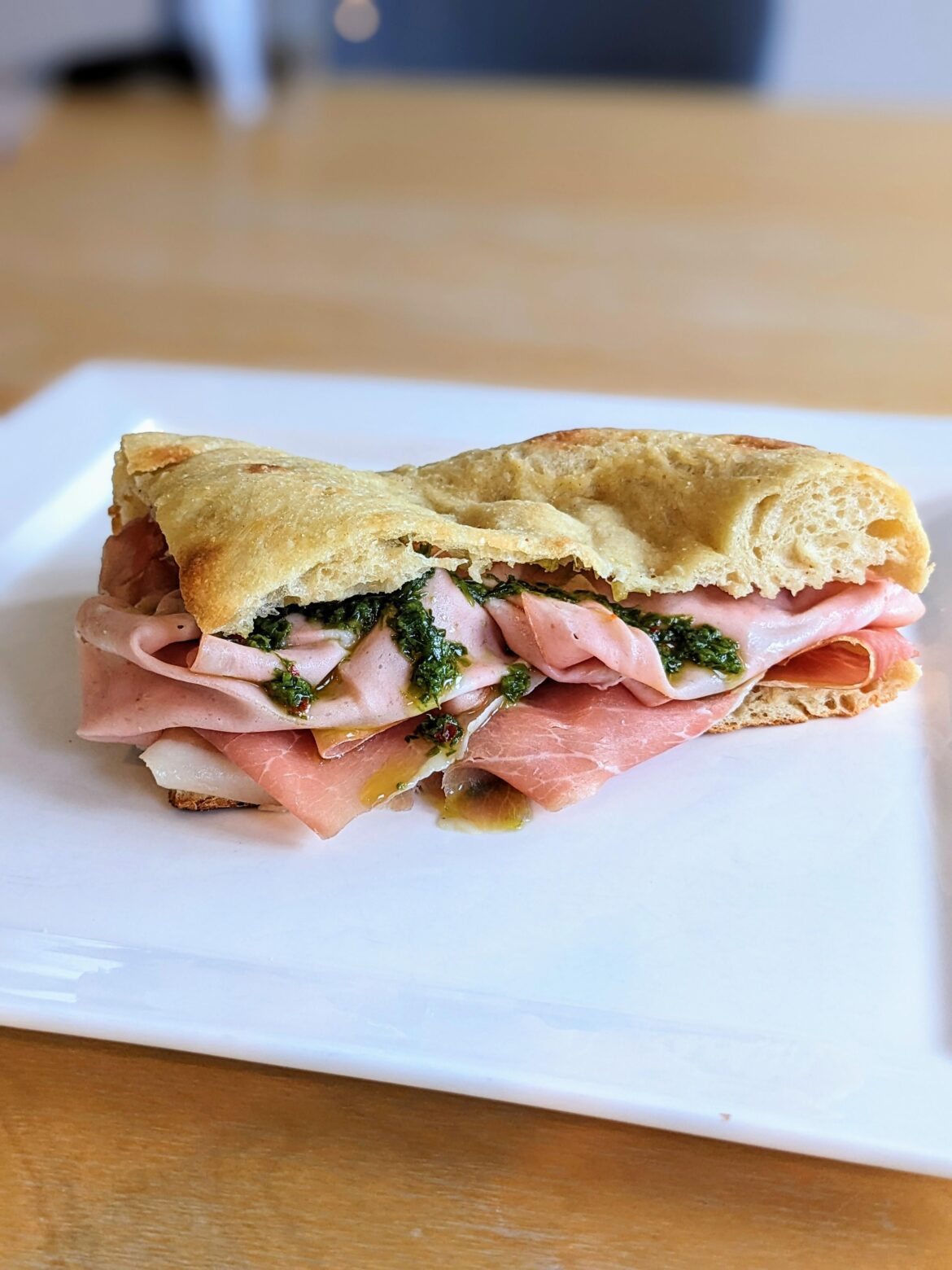 Prosciutto, mortadella & pesto on homemade pizza bianca