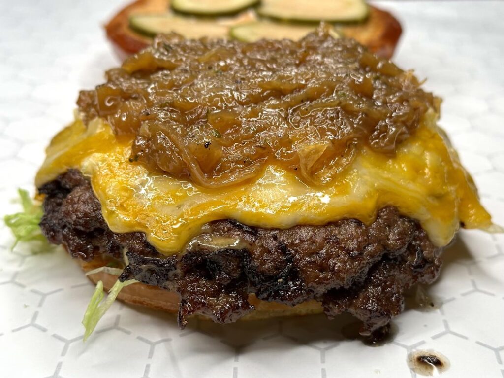Weekly smash burger with raw and caramelized onions