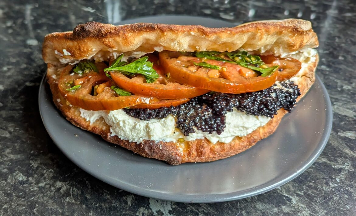 Marinated Winter tomatoes, homemade curd cheese, lumpfish roe