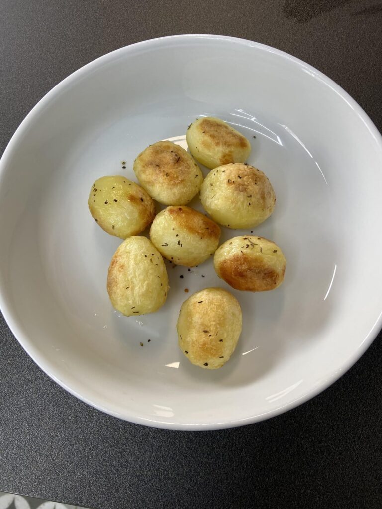 Chilli and cheese on roast potatoes