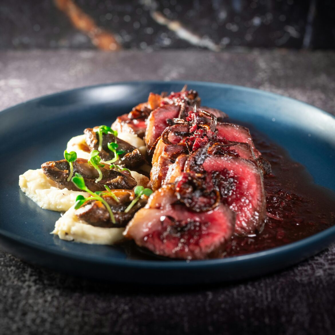 Red wine sauce, steak, and potatoes.