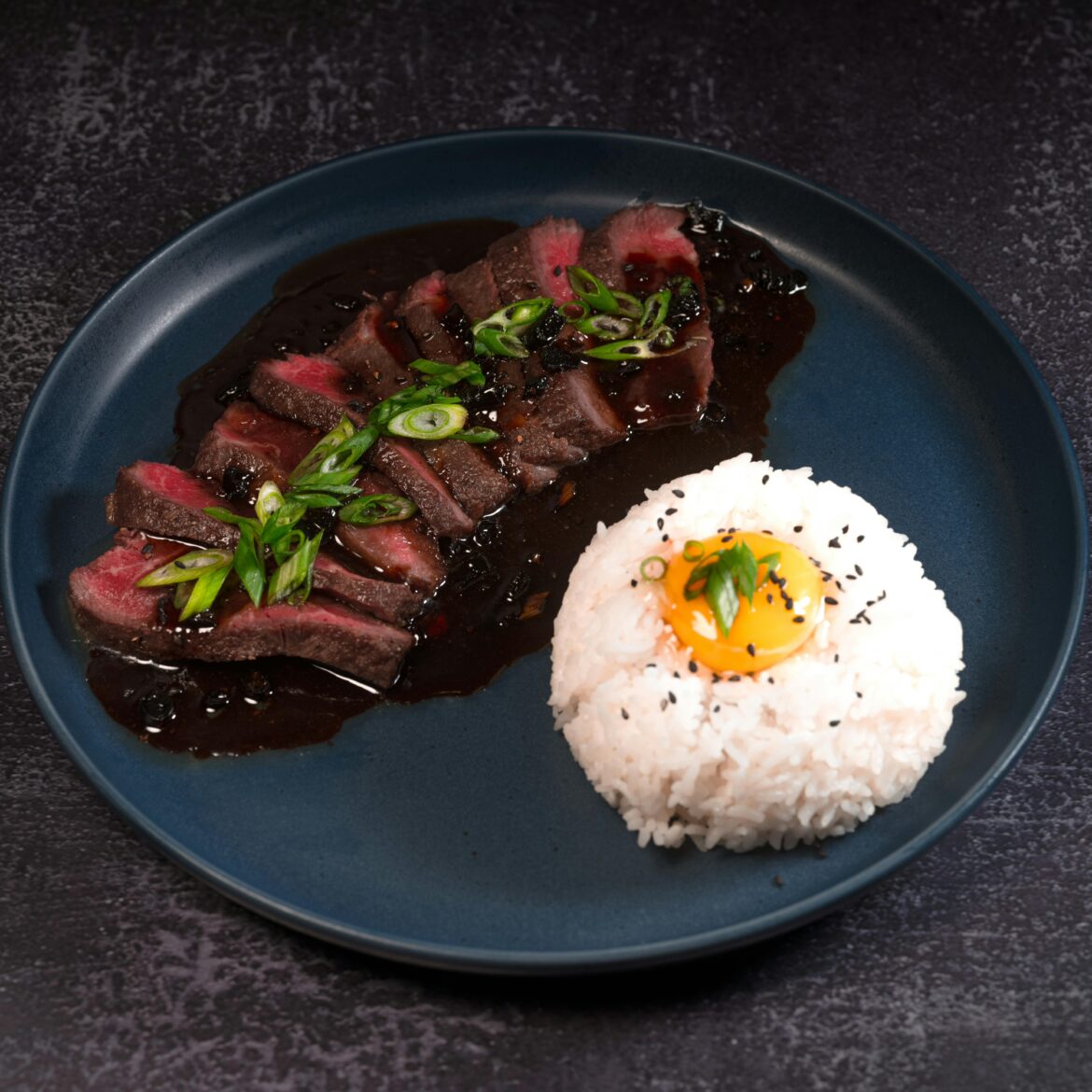 Teriyaki caramel, steak, and egg.