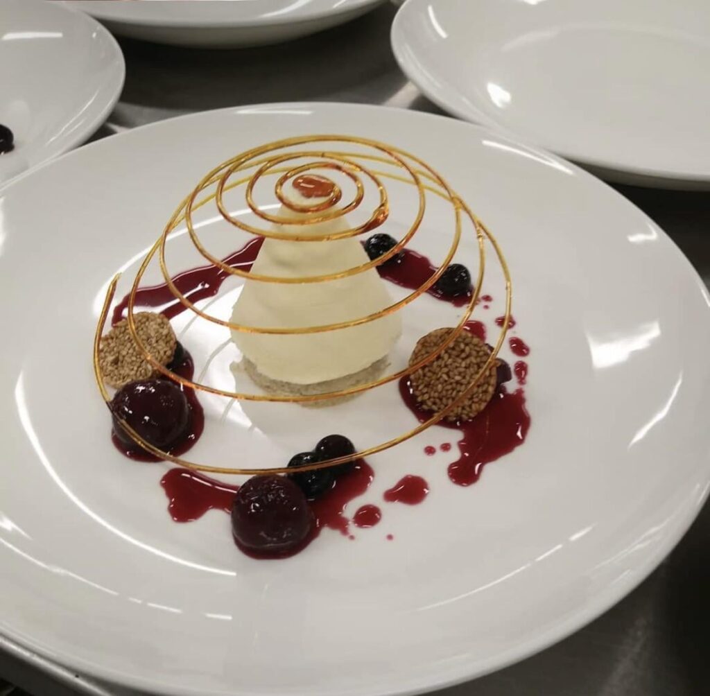 Grand Marnier parfait with a sugar spiral that I made in pastry school ☺️