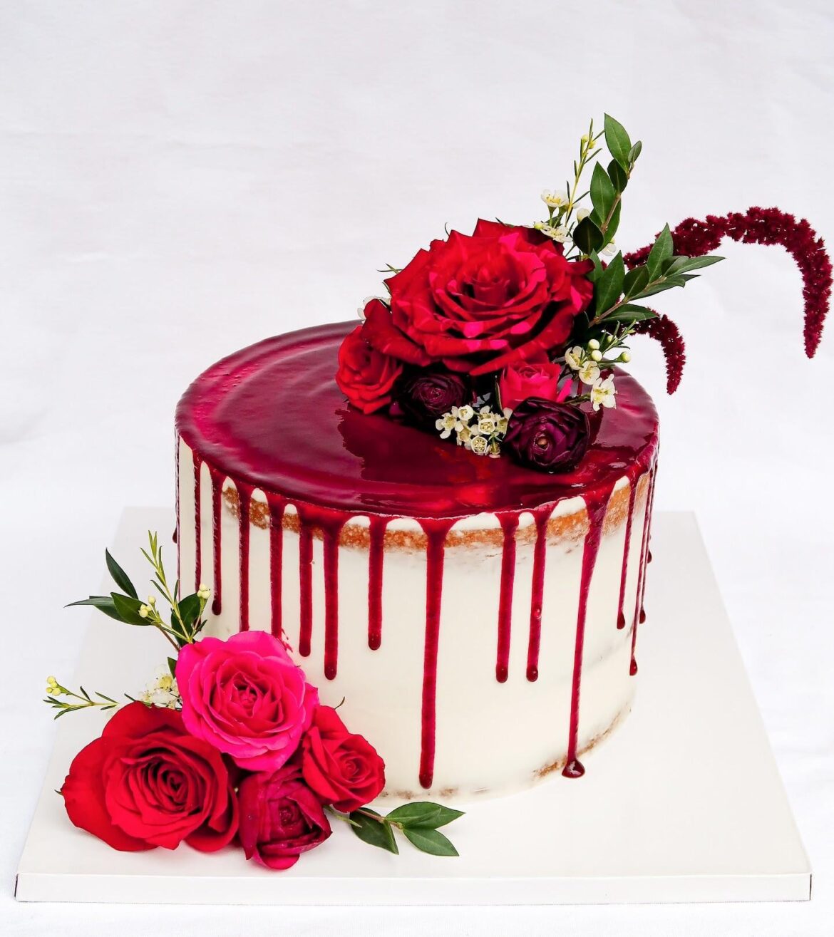 I made this vanilla cake with triple berry coulis drip for a birthday