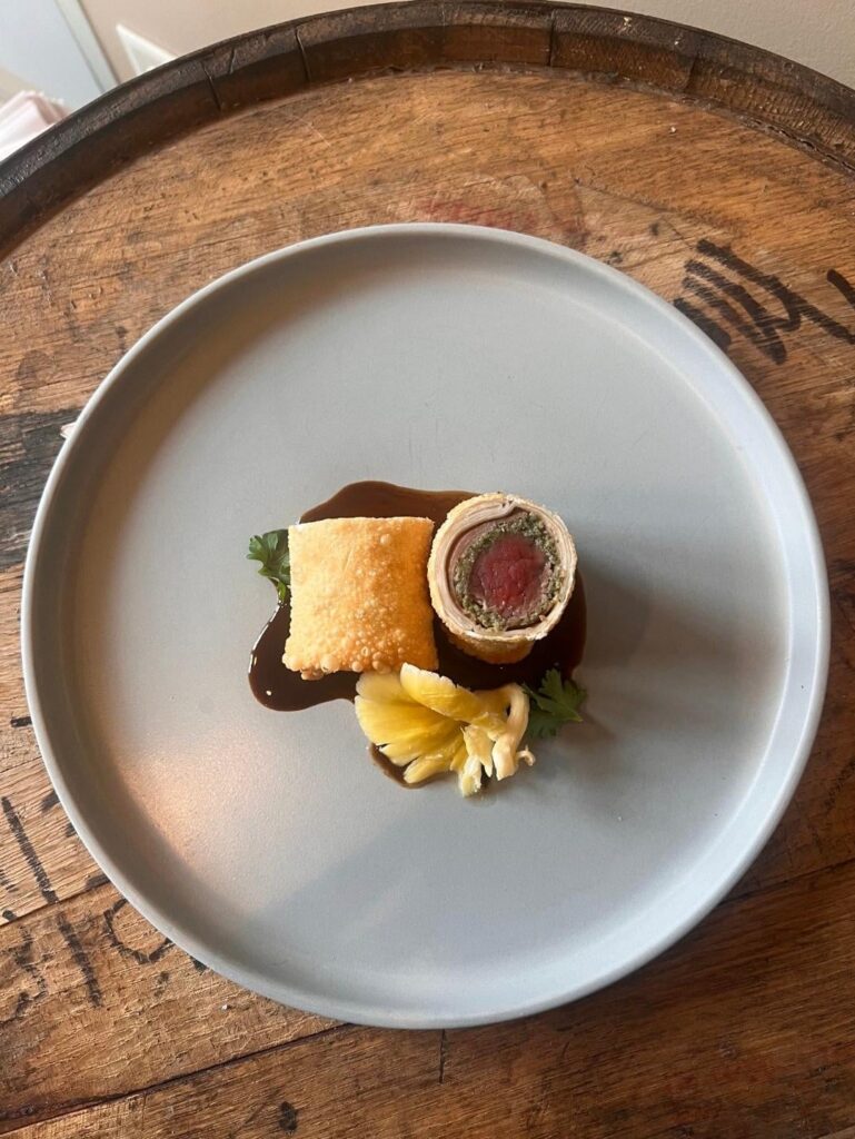 Beef wellington eggroll, mushroom xo sauce, cold pickled oyster mushroom