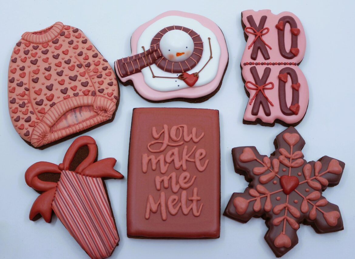 A few chocolate Valentine's Day cookies. I love the melted snowman, inspired by The Miller's Wife. The snowman's head is a white Lindor truffle (under the icing). Snowman cookie cutter from The Cookiery
