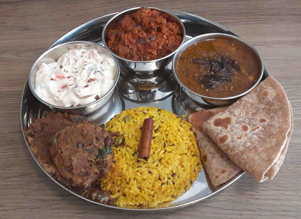Veg Thali: Soya Keema, Dal Tadka, Chapati, Haldi Chawal, Rajma Aloo Tikki, Carrot Cashew Raita