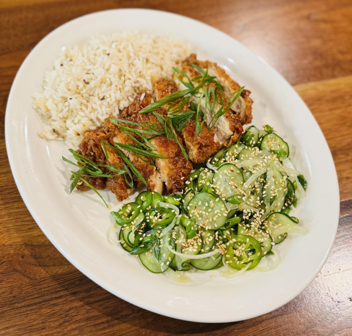 took over as head chef at one of the restaurants my boss owns. one of our new menu items- Thai Chicken Platter- Fried Chicken Thigh tossed with Sweet Thai Chili, Coconut Rice, Cucumber Salad w/ Sesame-Lime Vinaigrette