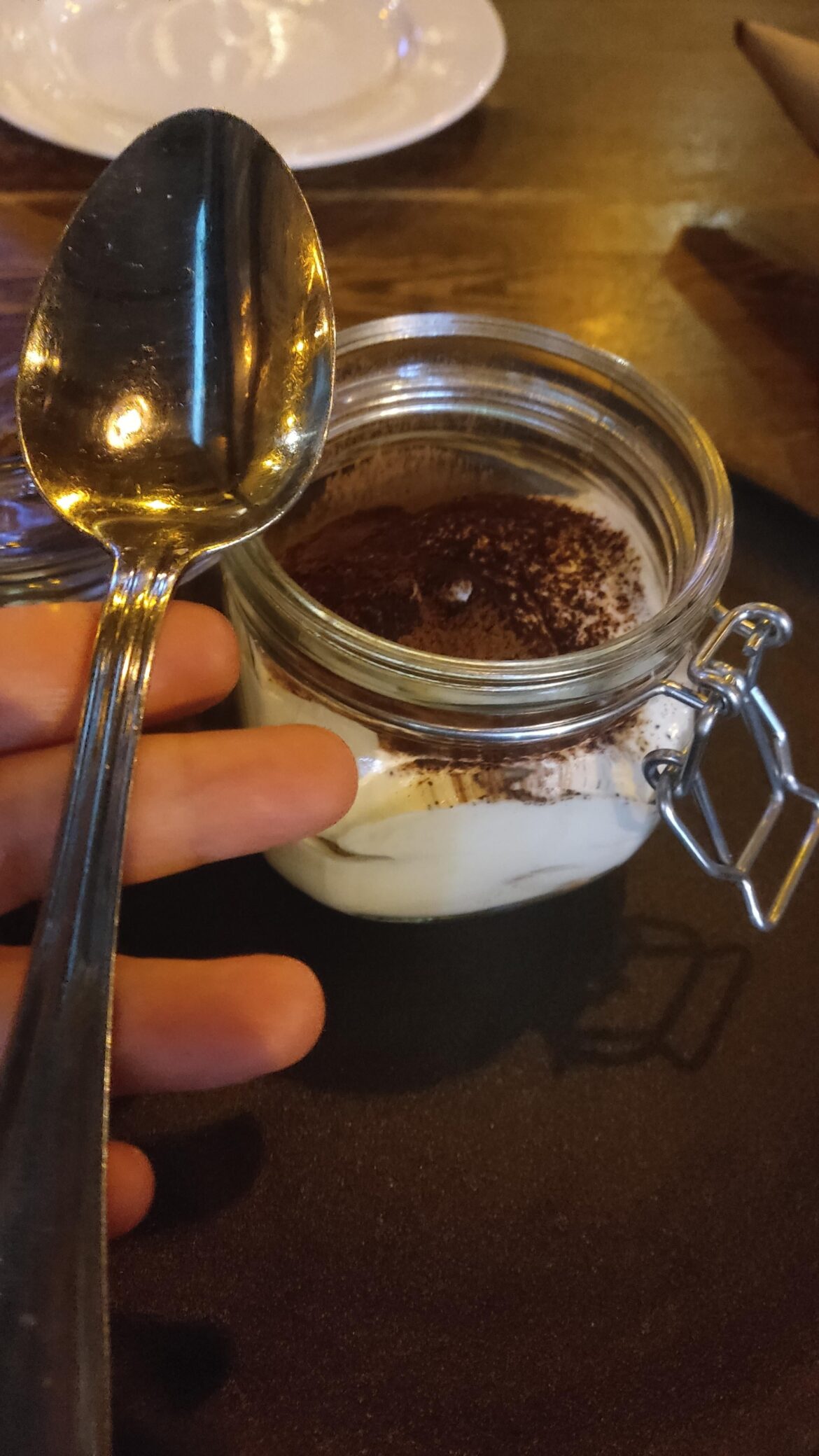 Here's my tiramisu in a jar on a cast iron plate with a gigantic spoon. "Svarnya" resoraunt at Timiryazevskaya station, Moscow.