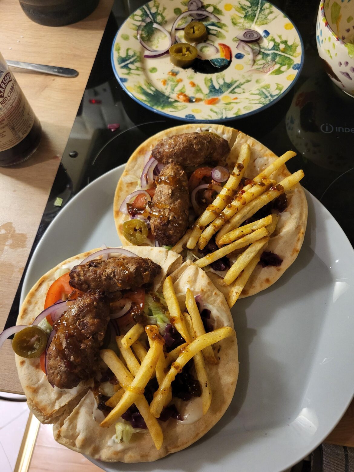 Lamb Kofta flatbreads with cumin mayo, pickled red cabbage, lamb fat fries and jalapeño jam