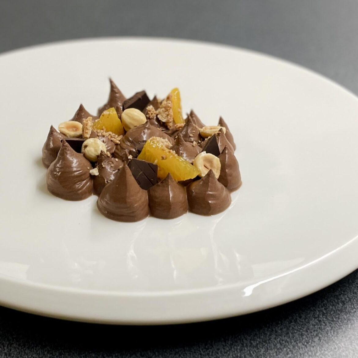 Chocolate, cardamom and orange mousse, amaretti, hazelnuts