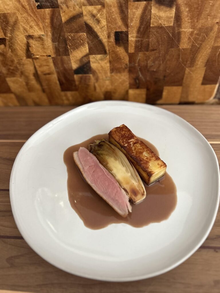 Duck breast confit, braised endive, pommes Dauphinoise, (homemade) cherry mead pan sauce