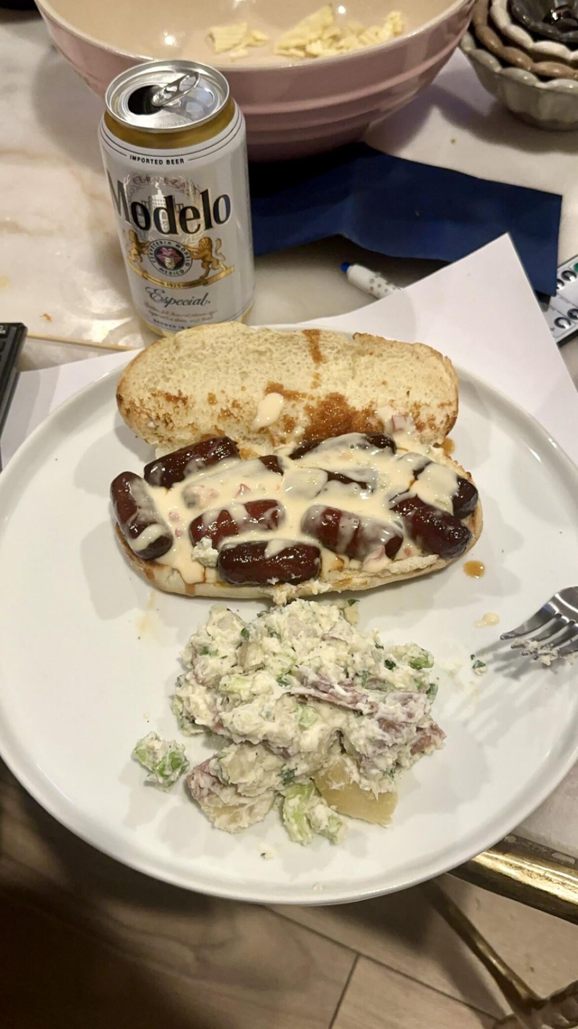 Post Super Bowl Leftover Meal - lit’l smokies and queso blanco on a roll with a side of potato salad