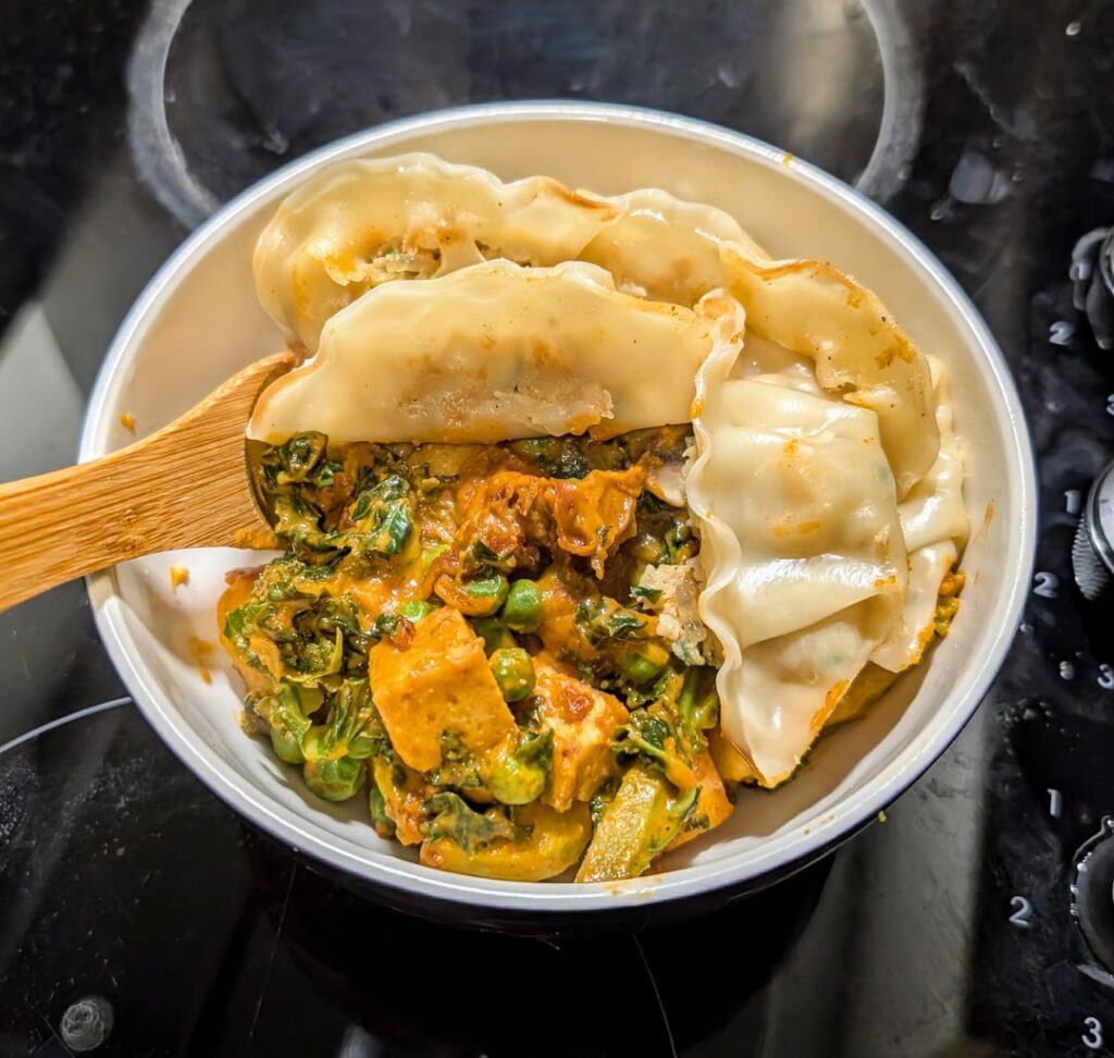 Tofu & veg in pb gochujang sauce with gyoza