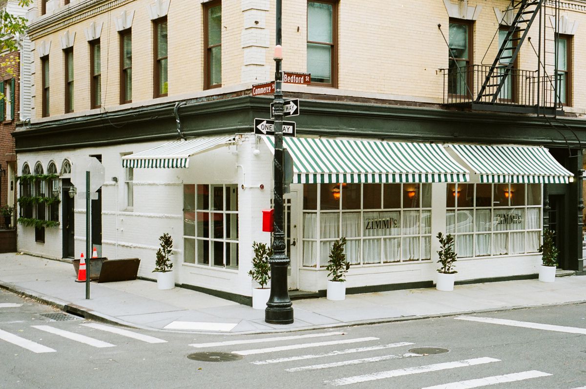 Outside Zimmi’s with green and white awnings.