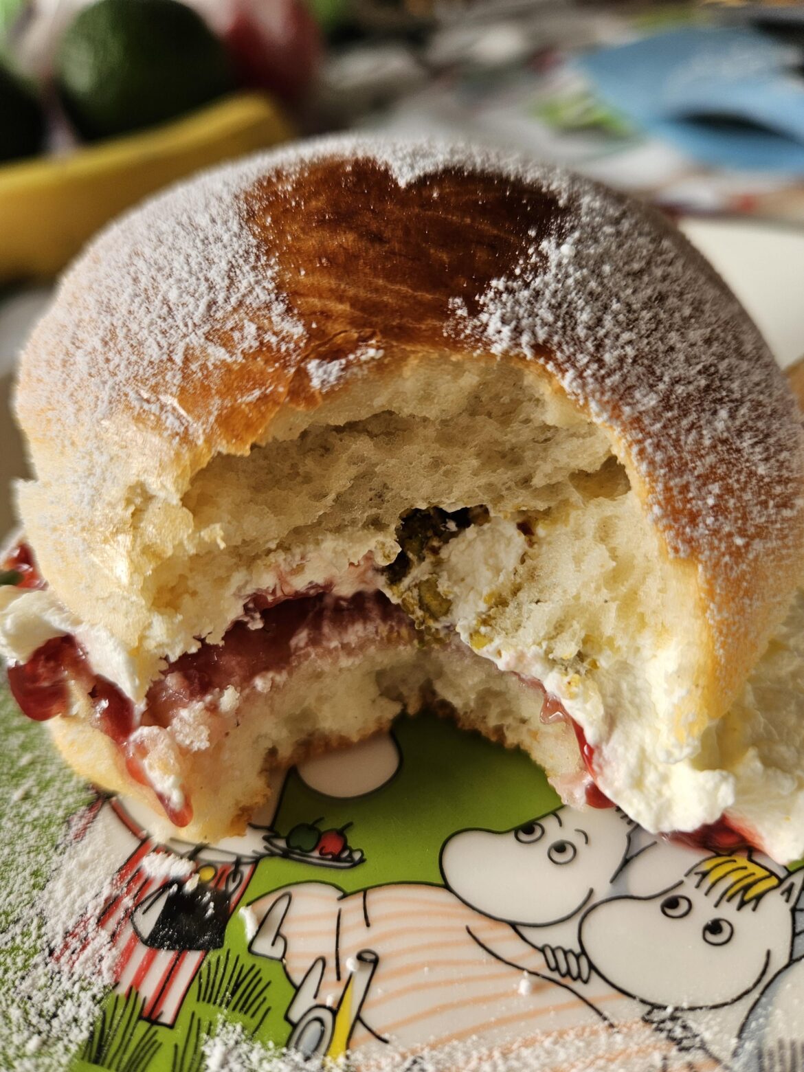 I forgot to take a pic of my fastelavnsbolle before biting into it, so here's a pic of a fastelavnsbolle I just bit into. My oldest kid made them