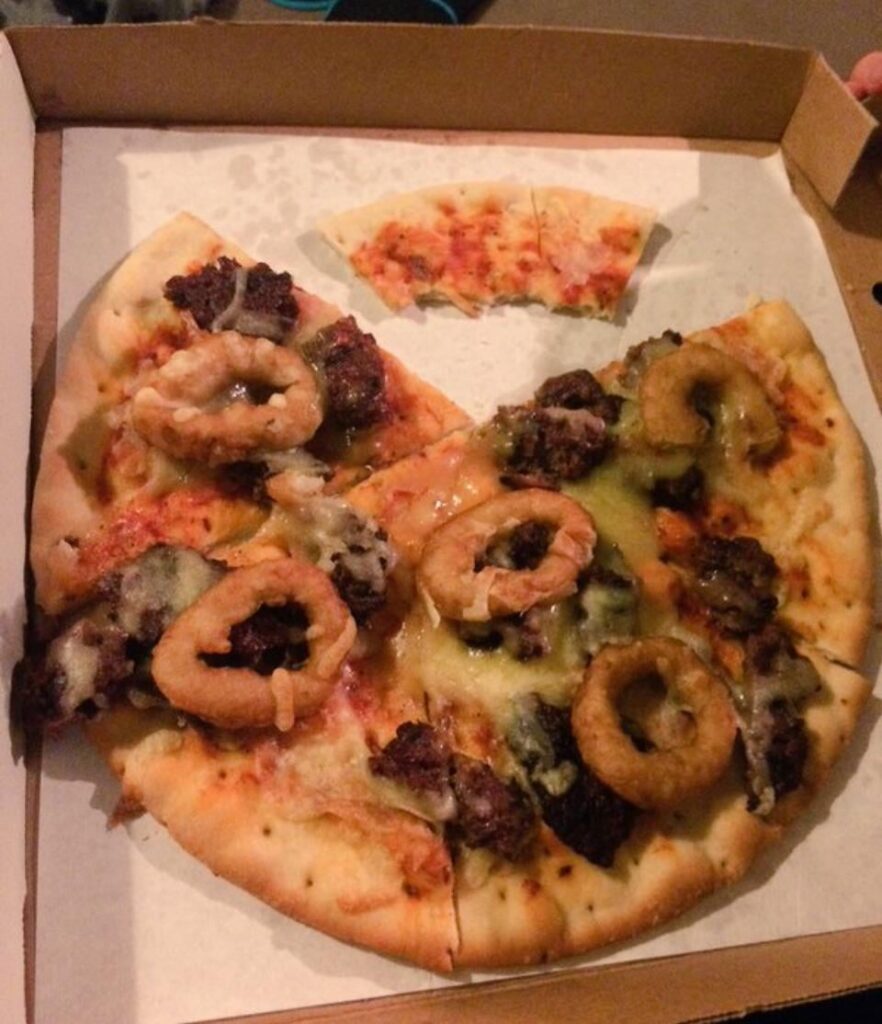 Onion ring pizza with beef chunks and nasty cheese I forgot to put away for months.