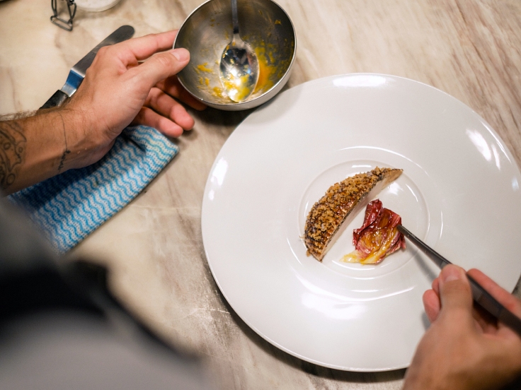 Organic Pintade, wild mushroom duxelles, sourdough, endive orange and jus by the head chef. (© Linh Pham/ MICHELIN Guide Vietnam)