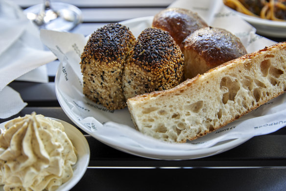 Bread basket with whipped garlic butter.
