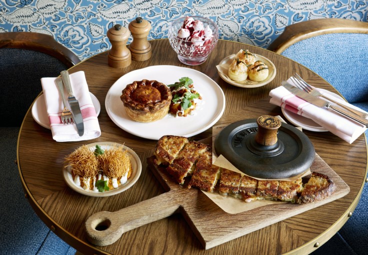 A spread of dishes at The Wigmore, including the famous cheese toastie. © The Langham, London