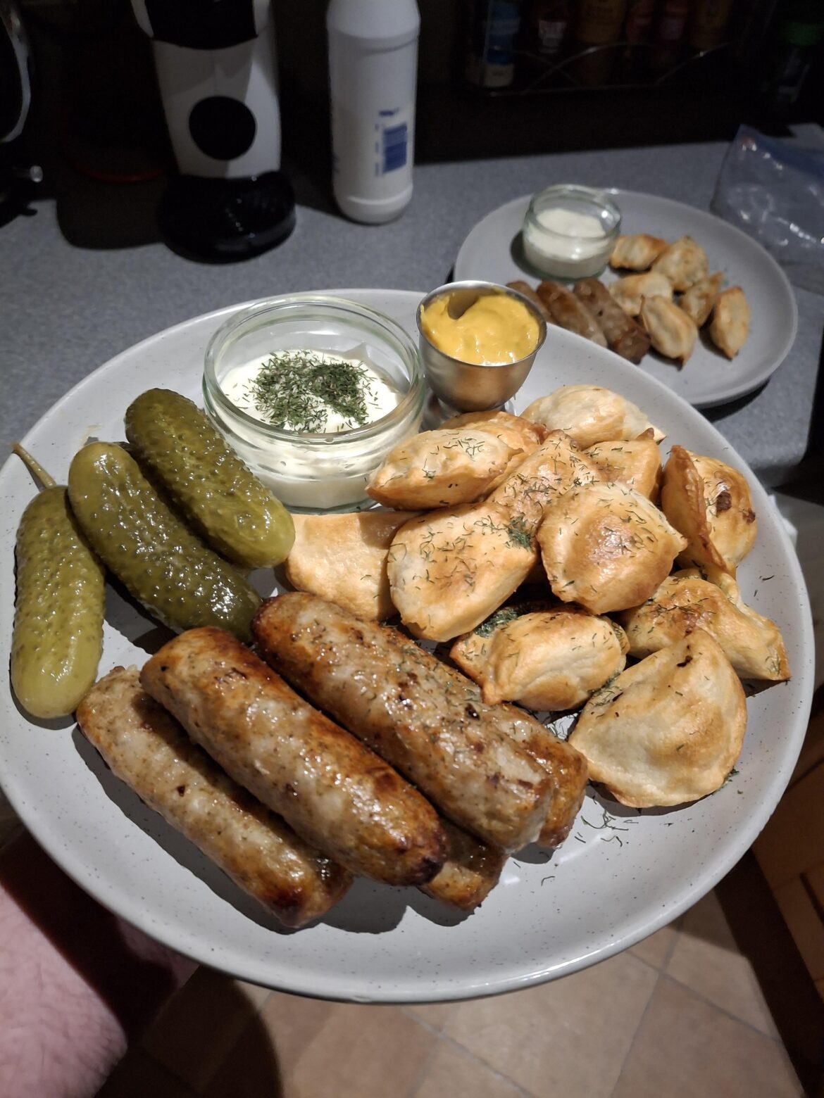 Simple tea of pan fried pierogi and sausages