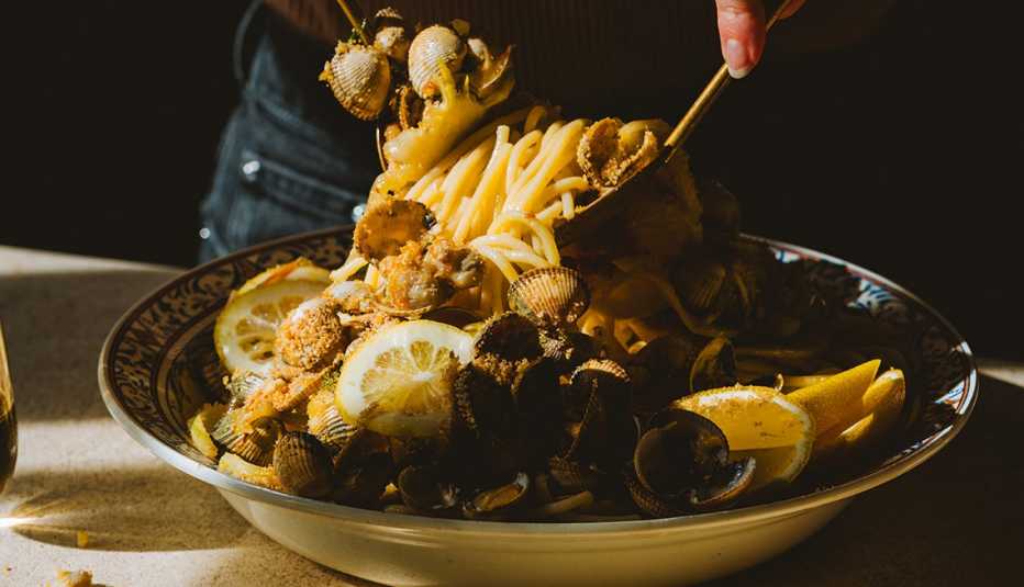 Pasta with clams, breadcrumbs and lemon in bowl