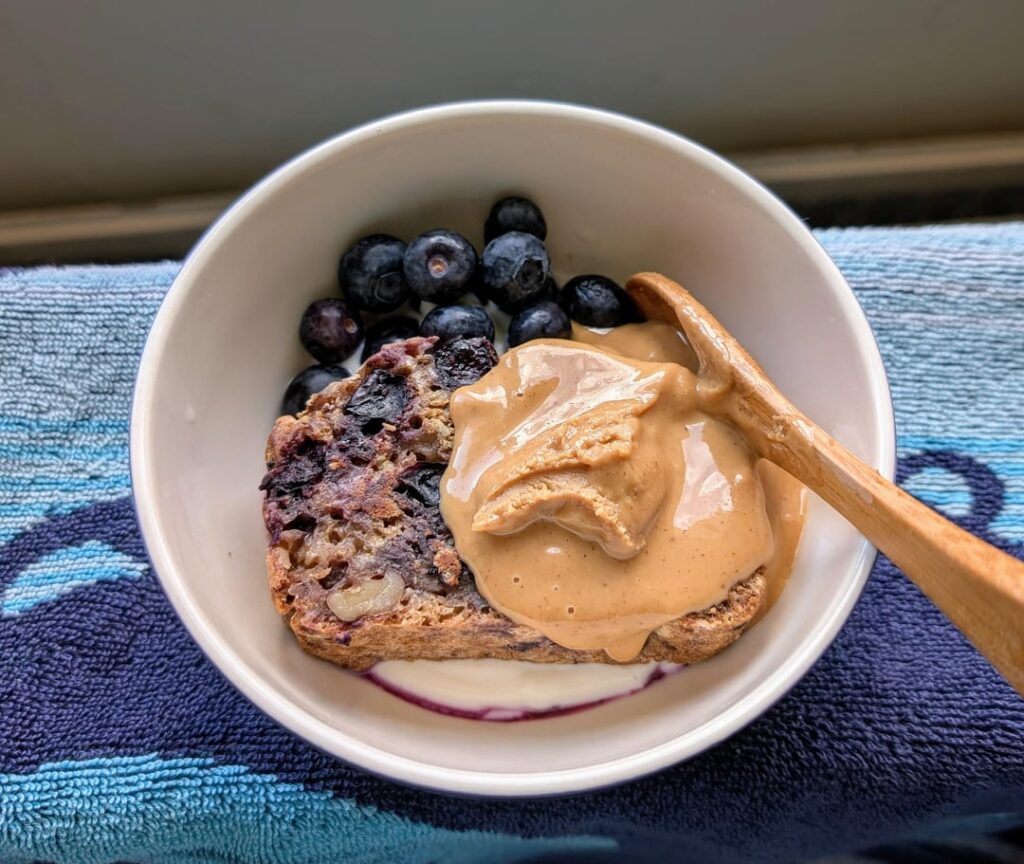 Blueberry banana bread on yoghurt with pb and 🫐