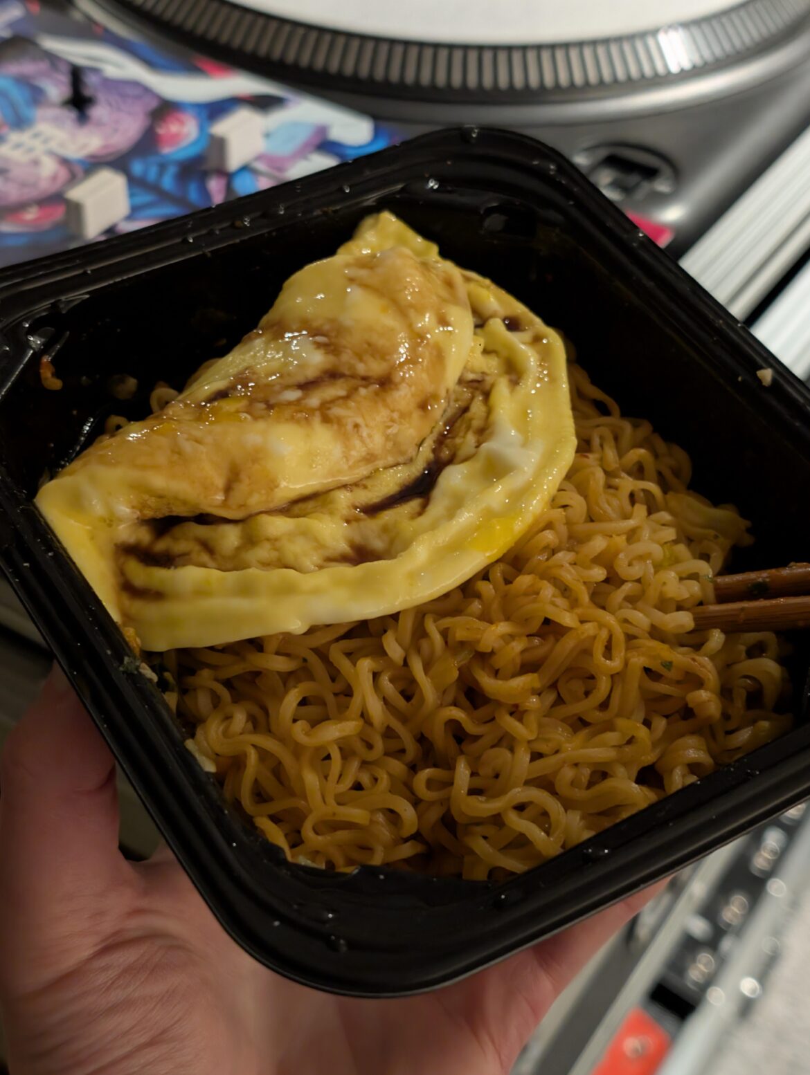 Two eggs mixed with water and mirin microwaved for 1:20 on top of spicy Yakisoba instant ramen 😋