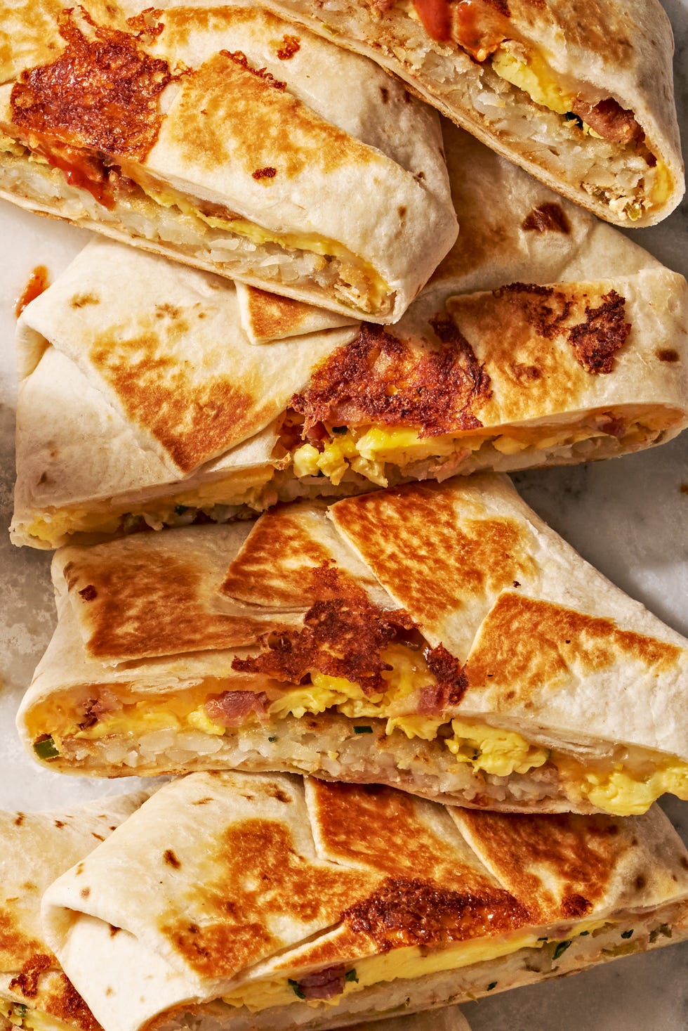 crunchwrap layered with eggs, hashbrowns, and bacon