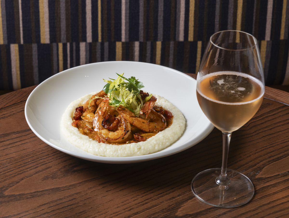Shrimp and grits and a glass of wine at Perseid.