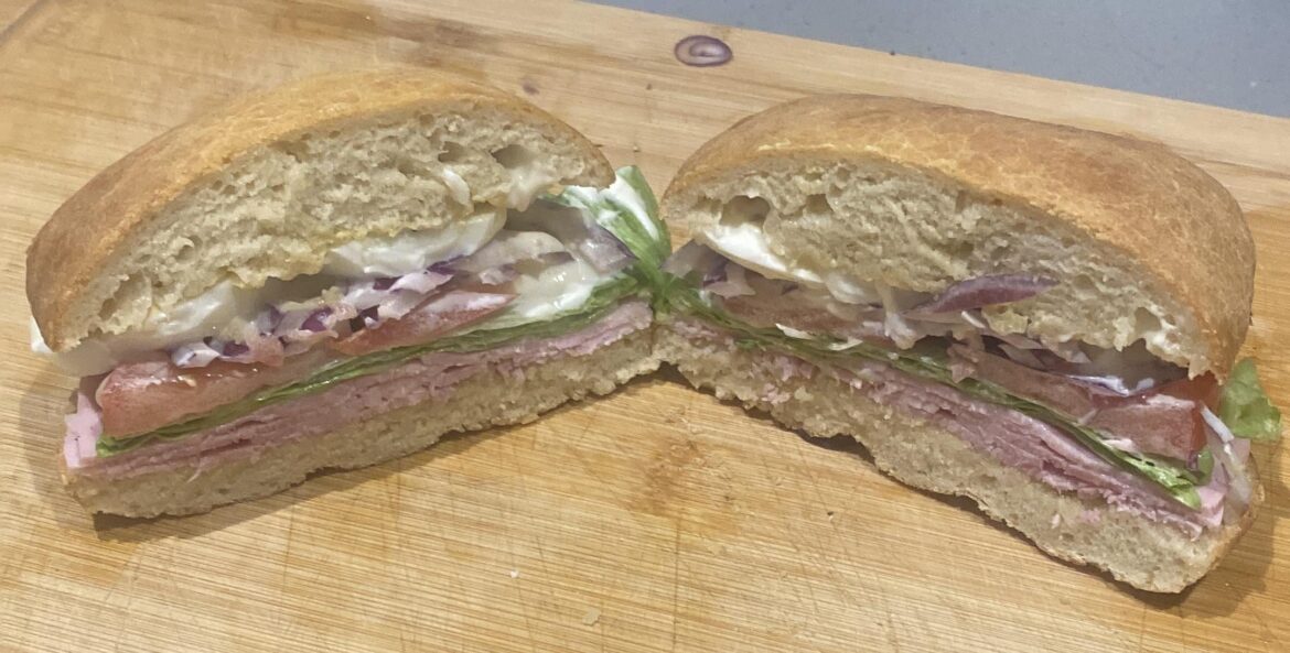 With homemade bread. Ham, lettuce, tomatoes, boiled eggs, shallots and mayo