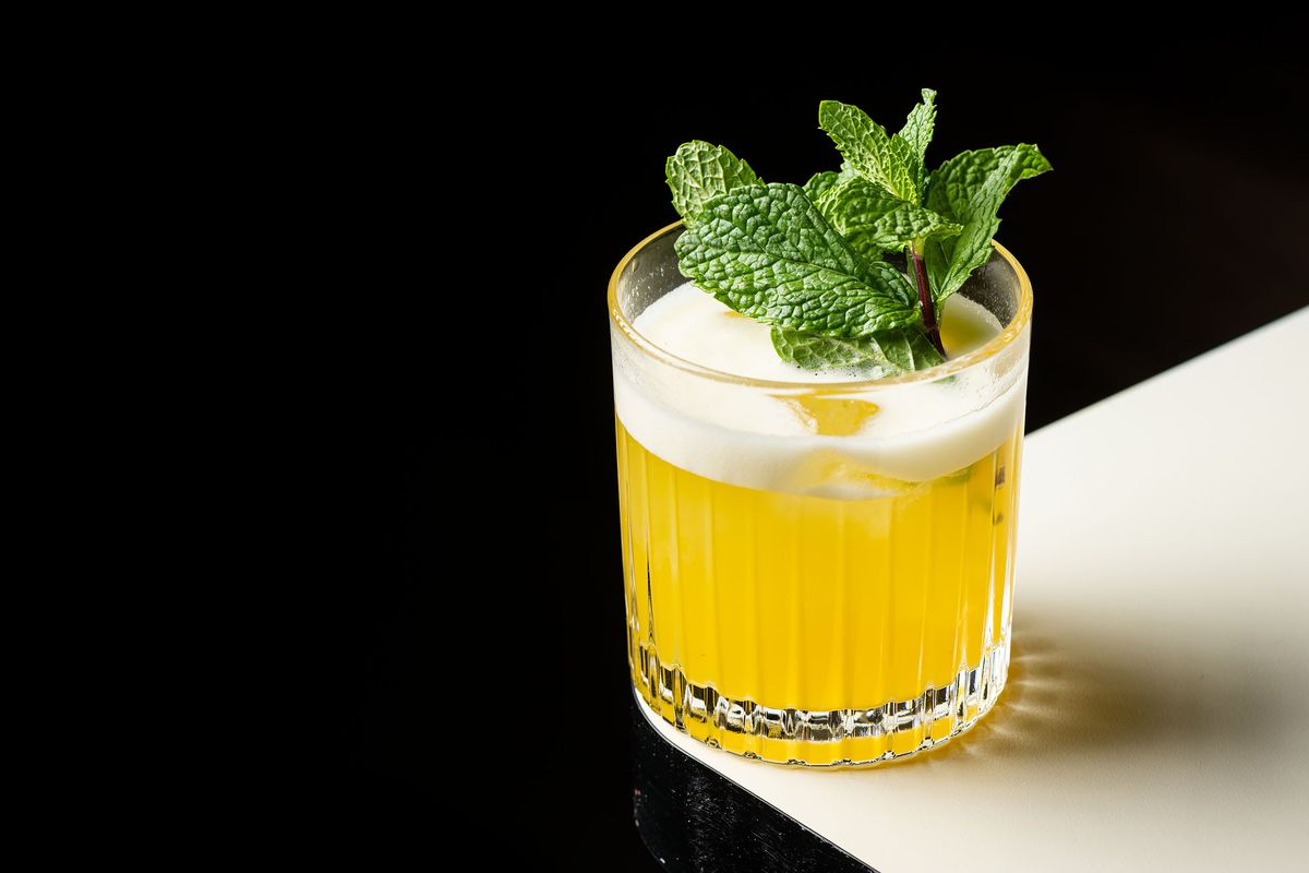 A Tequila gimlet set on a white counter at Bar Etoile.