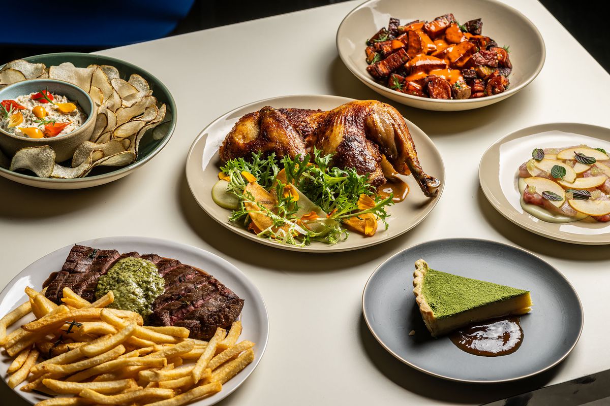 A selection of dishes at Bar Etoile including a roast chicken and steak frites.
